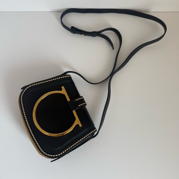 Salvatore Ferragamo Handbags - Salvatore Ferragamo Sabine Black and Gold Crossbody Bag